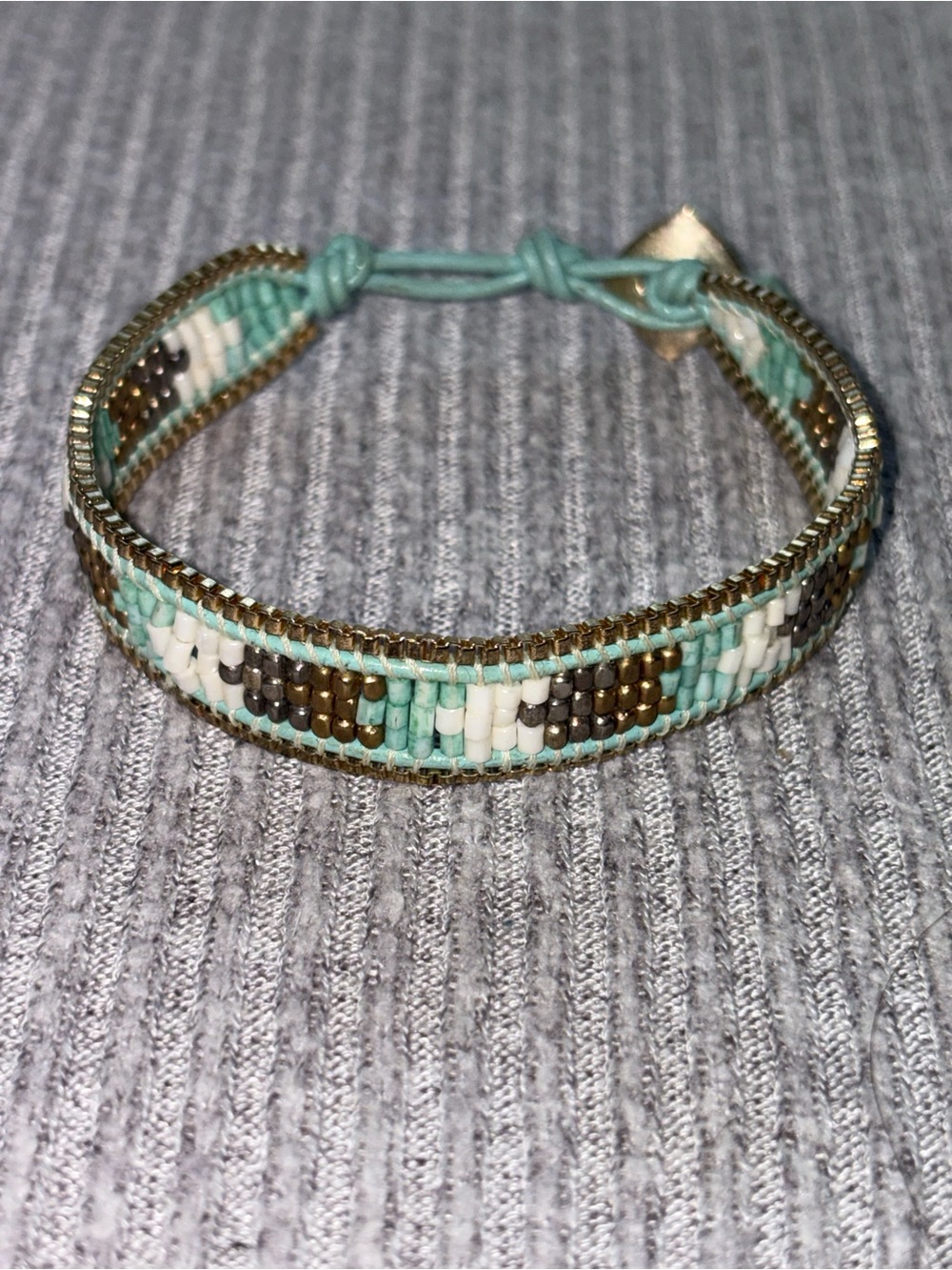 Bohemian theme Nakamol signed blue, white & gold tone microbeaded bracelet